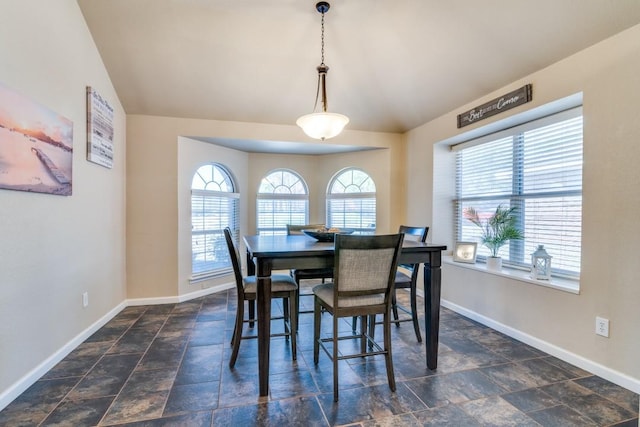 kitchen with a center island, appliances with stainless steel finishes, under cabinet range hood, light countertops, and a sink