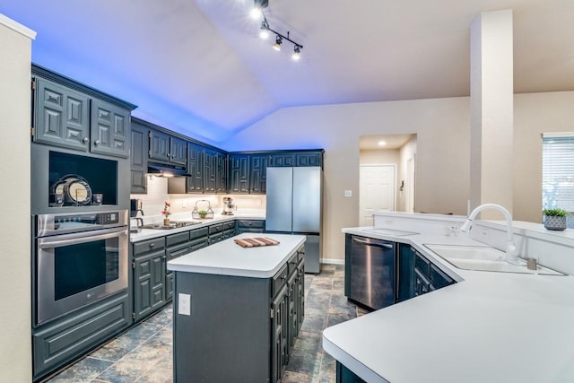 kitchen featuring visible vents, open floor plan, light countertops, freestanding refrigerator, and a kitchen island with sink