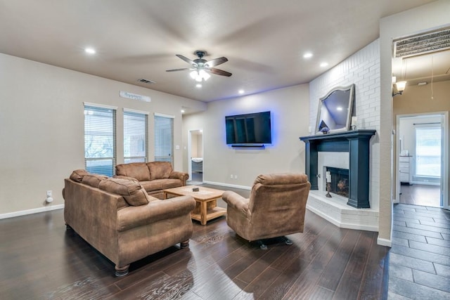 living area featuring visible vents, baseboards, ceiling fan, dark wood finished floors, and recessed lighting
