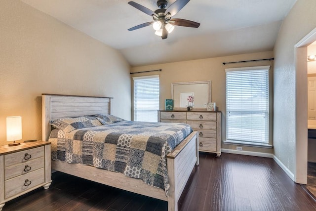 bedroom featuring dark wood-style flooring, baseboards, a ceiling fan, and lofted ceiling