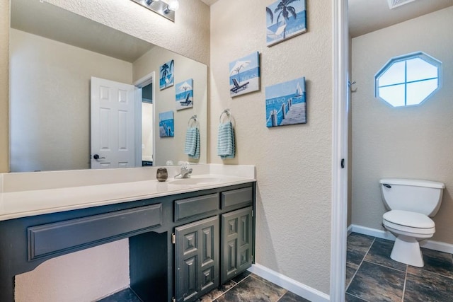 office area featuring lofted ceiling, dark wood-style flooring, baseboards, and ceiling fan