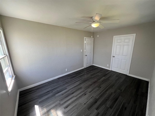 2912 W Elm St, Denison, TX 75020 - unfurnished room with dark wood-style flooring, baseboards, and a ceiling fan