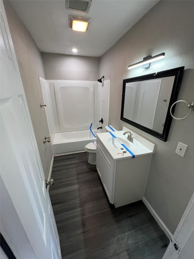 2912 W Elm St, Denison, TX 75020 - full bathroom featuring visible vents, shower / tub combination, vanity, and wood finished floors