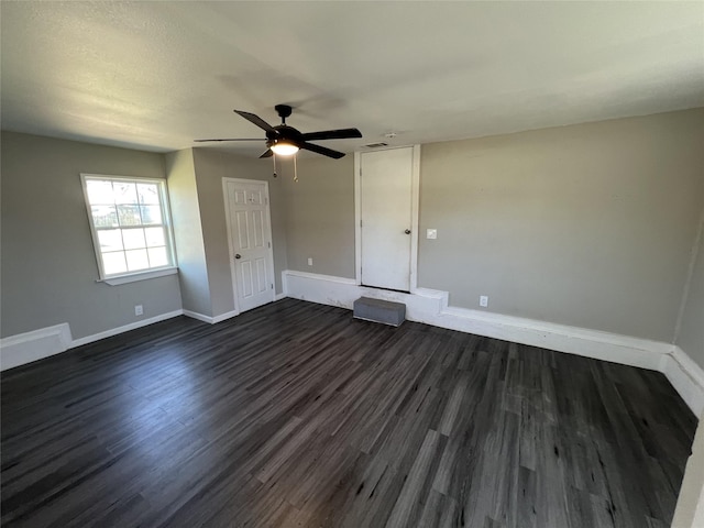2912 W Elm St, Denison, TX 75020 - interior space featuring visible vents, baseboards, a ceiling fan, and dark wood finished floors