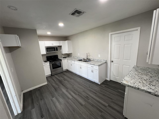 2912 W Elm St, Denison, TX 75020 - kitchen with visible vents, white cabinetry, a sink, and appliances with stainless steel finishes