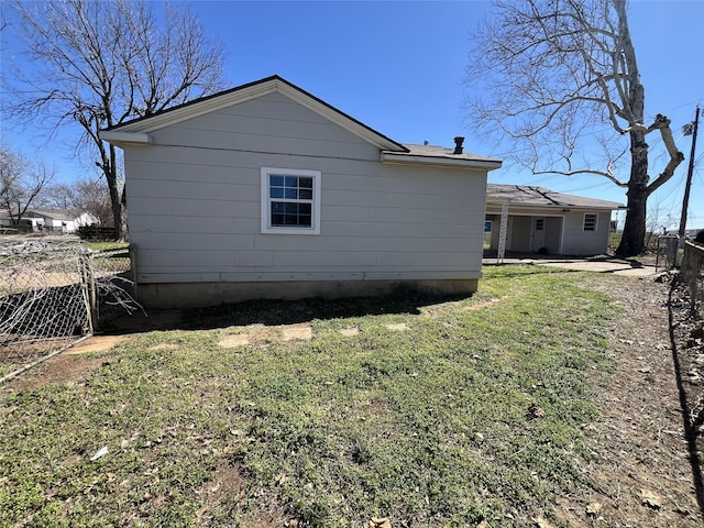 2912 W Elm St, Denison, TX 75020 - view of property exterior with a patio, fence, and a lawn