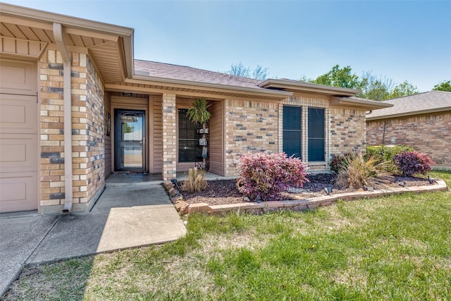 6361 Hunters Glen Dr, Watauga, TX 76148 - doorway to property featuring brick siding and a shingled roof