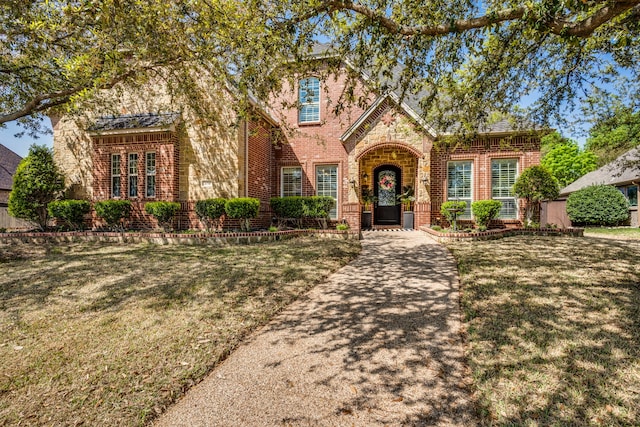 500 Lismore Dr, Mansfield, TX 76063 - english style home with a front yard and brick siding