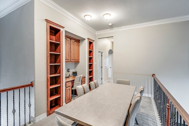 500 Lismore Dr, Mansfield, TX 76063 - dining area featuring arched walkways, a textured ceiling, light colored carpet, ornamental molding, and baseboards