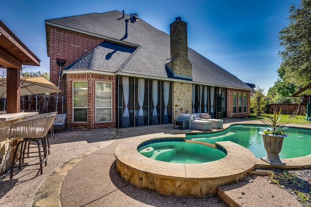 500 Lismore Dr, Mansfield, TX 76063 - back of house featuring a chimney, a patio area, brick siding, a fenced backyard, and a shingled roof