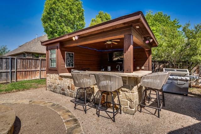 500 Lismore Dr, Mansfield, TX 76063 - view of patio featuring a grill, a fenced backyard, a ceiling fan, outdoor dry bar, and a sink