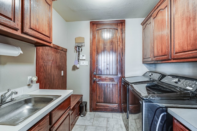 500 Lismore Dr, Mansfield, TX 76063 - clothes washing area featuring a textured ceiling, separate washer and dryer, marble finish floor, a sink, and cabinet space