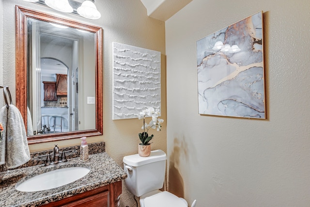 500 Lismore Dr, Mansfield, TX 76063 - half bath with toilet, vanity, and a textured wall