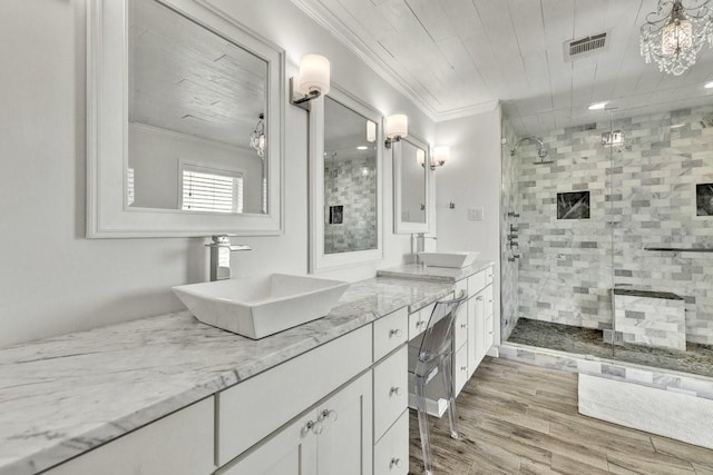 505 Heyser Dr, Dallas, TX 75224 - full bathroom featuring a shower stall, visible vents, ornamental molding, and a sink
