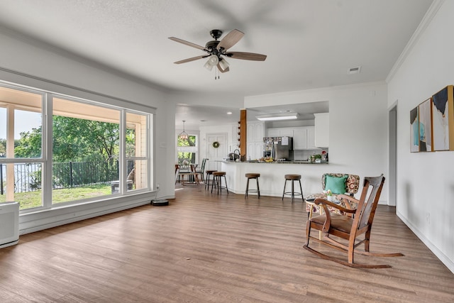 105 Park Trail Pl, Joshua, TX 76058 - living area with ceiling fan, wood finished floors, crown molding, and baseboards