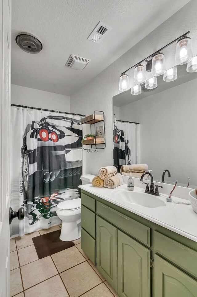 105 Park Trail Pl, Joshua, TX 76058 - full bathroom with vanity, toilet, tile patterned flooring, a textured ceiling, and a shower with curtain
