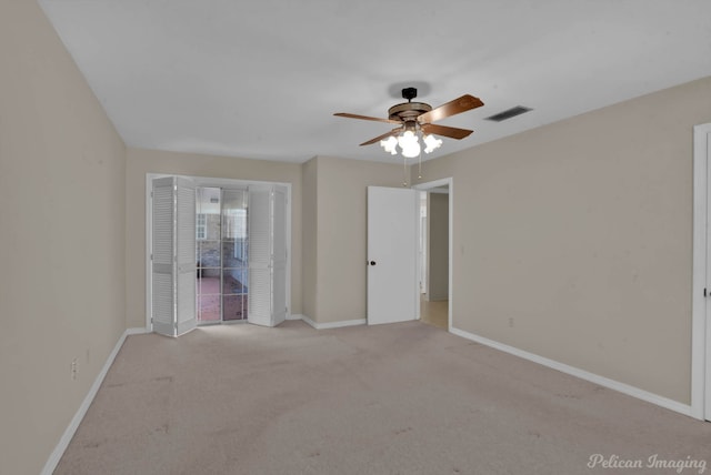 7321 Montclair Dr, Shreveport, LA 71105 - unfurnished bedroom with light colored carpet, baseboards, and a ceiling fan