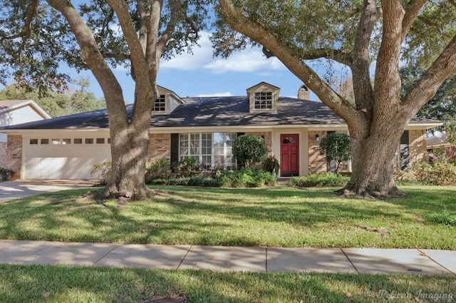 7321 Montclair Dr, Shreveport, LA 71105 - view of front of property featuring brick siding, a garage, a front lawn, and driveway