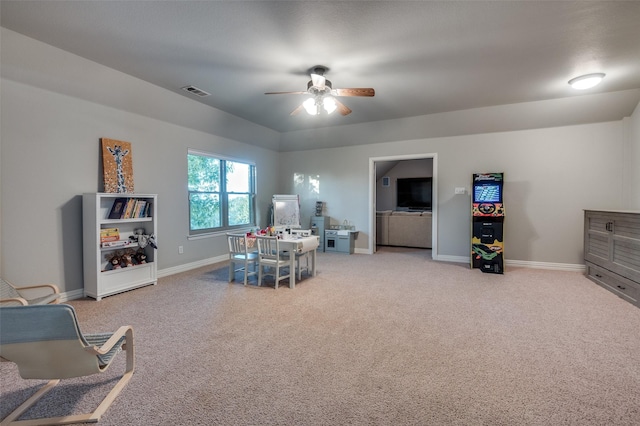 recreation room with ceiling fan, baseboards, carpet flooring, and visible vents