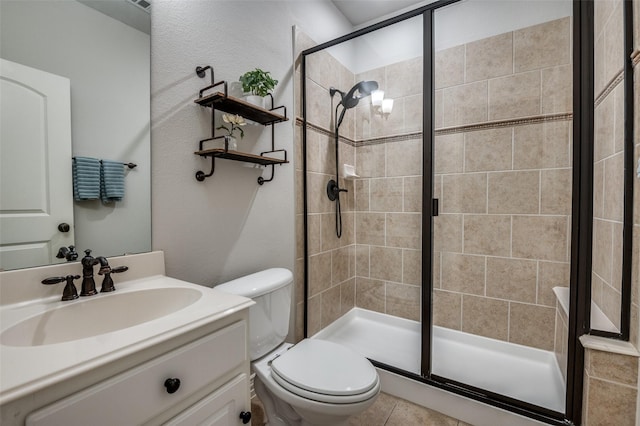 full bathroom featuring toilet, vanity, and a stall shower