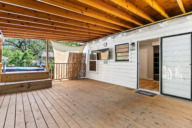wooden deck featuring a jacuzzi