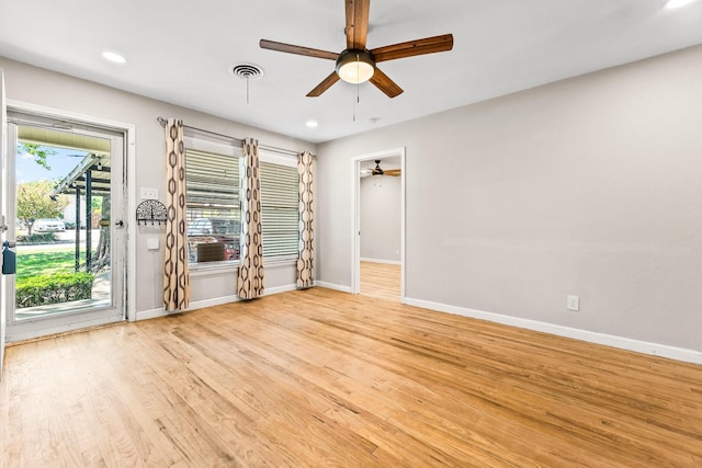 spare room featuring baseboards, visible vents, recessed lighting, a ceiling fan, and wood finished floors