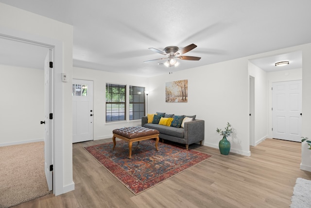 811 N Cooper St, Arlington, TX 76011 - living area featuring a ceiling fan, light wood-style flooring, and baseboards