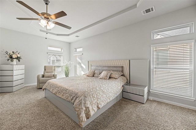 1036 Rutherford St, Frisco, TX 75036 - bedroom featuring a tray ceiling, carpet, baseboards, ceiling fan, and visible vents