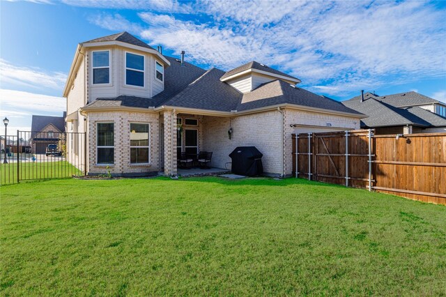 1036 Rutherford St, Frisco, TX 75036 - back of property with a garage, a shingled roof, a fenced backyard, a yard, and brick siding