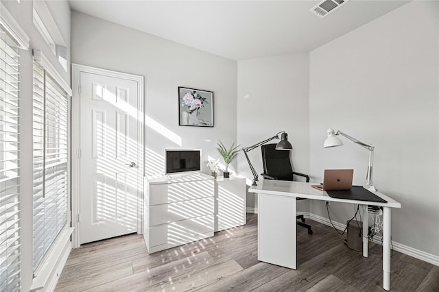 1036 Rutherford St, Frisco, TX 75036 - office featuring visible vents, wood finished floors, and baseboards