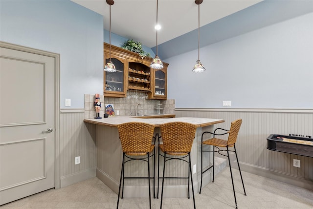 5205 Coral Springs Dr, Flower Mound, TX 75022 - indoor wet bar with wainscoting, hanging light fixtures, and vaulted ceiling