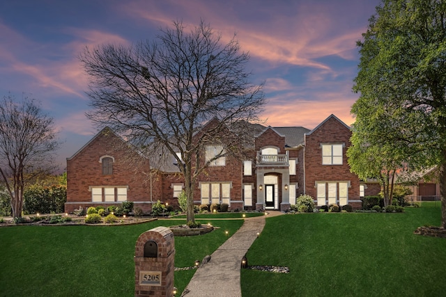 5205 Coral Springs Dr, Flower Mound, TX 75022 - view of front facade with a front yard and brick siding