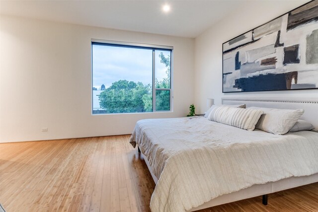 4401 Roseland Ave Unit A, Dallas, TX 75204 - bedroom with wood finished floors