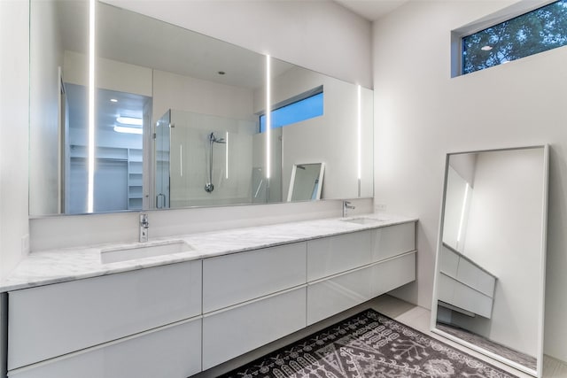 4401 Roseland Ave Unit A, Dallas, TX 75204 - full bathroom featuring a shower stall, plenty of natural light, double vanity, and a sink