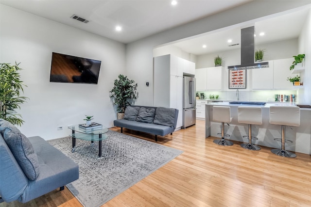 4401 Roseland Ave Unit A, Dallas, TX 75204 - living room featuring light wood-type flooring, visible vents, and recessed lighting
