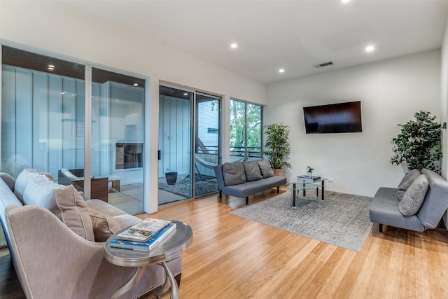 4401 Roseland Ave Unit A, Dallas, TX 75204 - living room with wood finished floors, visible vents, and recessed lighting