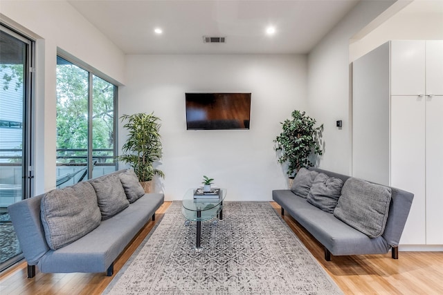 4401 Roseland Ave Unit A, Dallas, TX 75204 - living room with recessed lighting, light wood finished floors, and visible vents