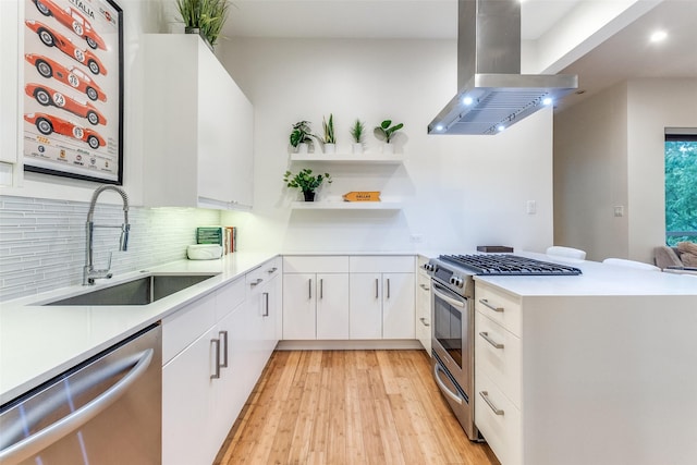 4401 Roseland Ave Unit A, Dallas, TX 75204 - kitchen with open shelves, a sink, light countertops, appliances with stainless steel finishes, and island range hood