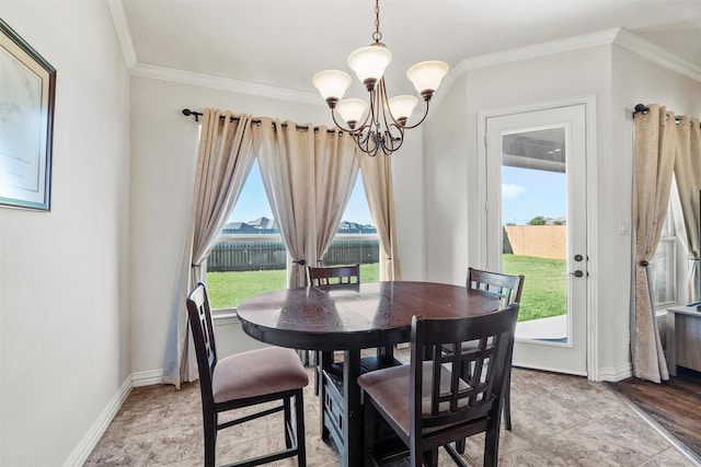 dining room featuring an inviting chandelier, baseboards, and ornamental molding