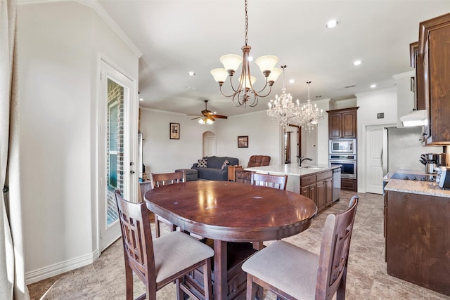 dining area with ceiling fan with notable chandelier, baseboards, ornamental molding, and recessed lighting