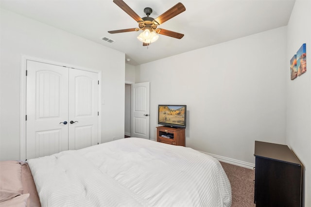 bedroom with baseboards, a closet, a ceiling fan, carpet floors, and visible vents