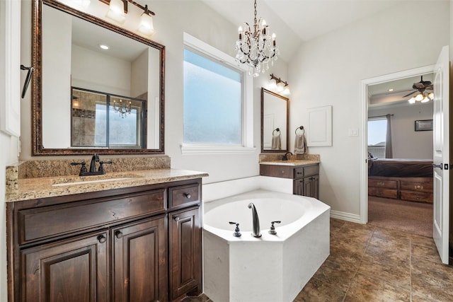 full bathroom featuring a shower stall, a wealth of natural light, a sink, and connected bathroom