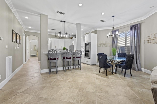 847 Bentwater Pkwy, Grand Prairie, TX 75104 - dining area with a chandelier, arched walkways, crown molding, baseboards, and recessed lighting
