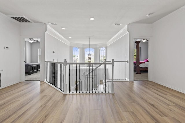 847 Bentwater Pkwy, Grand Prairie, TX 75104 - hall featuring light wood-type flooring, an upstairs landing, ornamental molding, baseboards, and recessed lighting