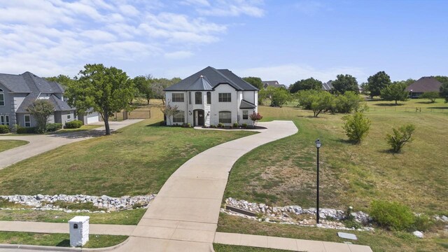 847 Bentwater Pkwy, Grand Prairie, TX 75104 - french country home with a front yard and driveway