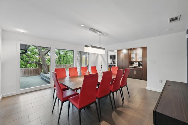 dining area featuring light tile patterned floors, baseboards, recessed lighting, and visible vents