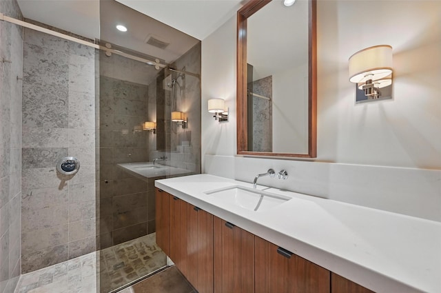 bathroom with visible vents, recessed lighting, walk in shower, and vanity