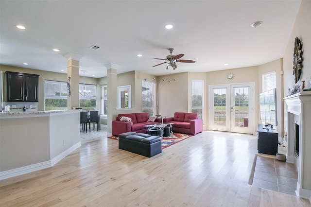 232 Wilshire Dr, Coppell, TX 75019 - living room featuring light wood-style floors, recessed lighting, visible vents, and ceiling fan with notable chandelier