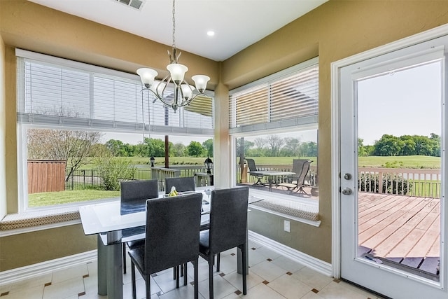 232 Wilshire Dr, Coppell, TX 75019 - tiled dining area with visible vents, baseboards, and a notable chandelier