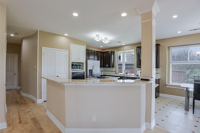 232 Wilshire Dr, Coppell, TX 75019 - kitchen featuring light stone countertops, recessed lighting, visible vents, and stainless steel appliances